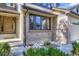 Exterior home detail showing brick accents, stone landscaping, and well-maintained front entrance at 16247 E Belleview Pl, Centennial, CO 80015