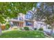 Inviting two-story home featuring a manicured lawn and mature trees in a desirable neighborhood at 16247 E Belleview Pl, Centennial, CO 80015