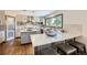 Bright kitchen with gray cabinetry, stainless steel appliances, and a quartz countertop island at 16247 E Belleview Pl, Centennial, CO 80015