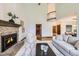 Spacious living room with fireplace, neutral paint and carpet at 16247 E Belleview Pl, Centennial, CO 80015