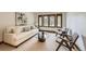 Cozy living room featuring a comfortable sofa, natural light, and stylish decor at 16247 E Belleview Pl, Centennial, CO 80015