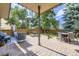 Outdoor patio with stone pavers, comfortable seating and shade for entertaining guests at 16247 E Belleview Pl, Centennial, CO 80015