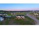 Aerial view of a newly built home in a neighborhood with manicured lawns and paved roads at 2741 Morning Run Ct, Franktown, CO 80116