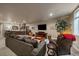 Comfortable basement featuring a wet bar, lounge area, and TV at 2741 Morning Run Ct, Franktown, CO 80116