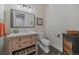 Bathroom featuring a wooden vanity with new fixtures, tiled floors, and modern style at 2741 Morning Run Ct, Franktown, CO 80116