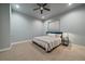 Well lit bedroom with neutral walls, carpeted floors, ceiling fan, and a window for natural light at 2741 Morning Run Ct, Franktown, CO 80116