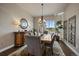 Bright dining room features a chandelier, large window, and sophisticated decor with seating for six at 2741 Morning Run Ct, Franktown, CO 80116