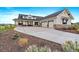 Beautiful two-story home with a stone and siding exterior, three-car garage, and well-manicured landscaping at 2741 Morning Run Ct, Franktown, CO 80116