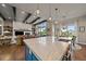 Open-concept kitchen with marble countertops, stainless steel appliances, and seamless flow into the living area at 2741 Morning Run Ct, Franktown, CO 80116