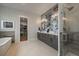 Spacious main bathroom features double sinks, decorative wall art, and a glass-enclosed shower at 2741 Morning Run Ct, Franktown, CO 80116