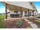 Covered patio with a dining table, grill, and comfortable seating area for outdoor relaxation and entertainment at 2741 Morning Run Ct, Franktown, CO 80116