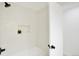 Clean bathroom with white tile and a bathtub at 6190 W Canyon Ave, Littleton, CO 80128