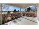 Covered patio with mountain views and landscaped backyard at 6190 W Canyon Ave, Littleton, CO 80128