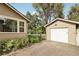 Detached garage with white door and side yard at 180 S Lamar St, Lakewood, CO 80226