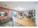 Spacious basement featuring hardwood floors, a brick fireplace and barn door access at 9361 Crestmore Way, Littleton, CO 80126