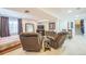 Finished basement with seating, entertainment center, and staircase at 9361 Crestmore Way, Littleton, CO 80126