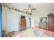 Bright bedroom with vaulted ceilings, built-in shelving, and ensuite bathroom at 9361 Crestmore Way, Littleton, CO 80126
