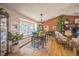 Bright dining room featuring hardwood floors, ample natural light and stylish furnishings at 9361 Crestmore Way, Littleton, CO 80126