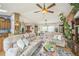 Open-concept living room featuring hardwood floors and stylish furniture at 9361 Crestmore Way, Littleton, CO 80126