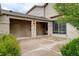 Spacious back patio featuring a covered area with a light fixture, leading to a sliding glass door and greenery at 490 Jackson St, Denver, CO 80206