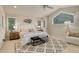 Cozy bedroom featuring decorative rug, large windows, ceiling fan, and an accent chair at 490 Jackson St, Denver, CO 80206
