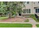 Traditional home exterior with large tree and manicured lawn for curb appeal at 490 Jackson St, Denver, CO 80206