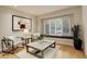 Bright living room with hardwood floors, large windows, and stylish furnishings for a cozy and modern space at 490 Jackson St, Denver, CO 80206
