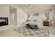 Spacious bedroom showcasing a fireplace, accent rug, and natural light from multiple windows at 490 Jackson St, Denver, CO 80206