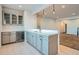 Basement bar with cabinets and wine cooler at 7071 Greenwater Cir, Castle Rock, CO 80108