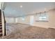 Spacious finished basement with carpet and bar area at 7071 Greenwater Cir, Castle Rock, CO 80108