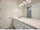 Modern bathroom with white vanity and large mirror at 7071 Greenwater Cir, Castle Rock, CO 80108