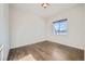 Spacious bedroom with hardwood floors and large window with a view at 7071 Greenwater Cir, Castle Rock, CO 80108