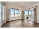 Bright dining room with hardwood floors, large windows, and access to deck at 7071 Greenwater Cir, Castle Rock, CO 80108