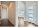 Bright and airy entryway with hardwood floors and view to living room at 7071 Greenwater Cir, Castle Rock, CO 80108