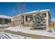 House exterior showcasing a two-car garage, covered porch, and evergreen tree at 7071 Greenwater Cir, Castle Rock, CO 80108