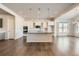 Modern kitchen with white cabinets, island, and stainless steel appliances at 7071 Greenwater Cir, Castle Rock, CO 80108