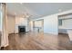 Living room with hardwood floors, fireplace, and views to the upper level at 7071 Greenwater Cir, Castle Rock, CO 80108