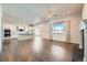 Open floor plan living room with hardwood floors and a fireplace at 7071 Greenwater Cir, Castle Rock, CO 80108