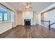 Open concept living room with hardwood floors and fireplace at 7071 Greenwater Cir, Castle Rock, CO 80108