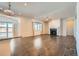 Spacious living room featuring hardwood floors, fireplace, and high ceilings at 7071 Greenwater Cir, Castle Rock, CO 80108