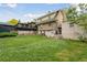 Expansive backyard featuring a lawn and rear view of the home at 1551 S University Blvd, Denver, CO 80210