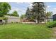 Large backyard showing the expansive lawn area and detached garage at 1551 S University Blvd, Denver, CO 80210