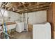 Unfinished basement features laundry units at 1551 S University Blvd, Denver, CO 80210