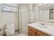 Bathroom features toilet, sink and shower area at 1551 S University Blvd, Denver, CO 80210