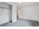 Cozy bedroom boasts neutral walls, and grey carpets and ample closet space at 1551 S University Blvd, Denver, CO 80210