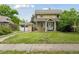 Traditional two-story home with a quaint front yard and a detached garage, showcasing classic curb appeal at 1551 S University Blvd, Denver, CO 80210