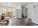 This living room offers natural light and original hardwood floors at 1551 S University Blvd, Denver, CO 80210