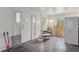 This living room offers natural light and original hardwood floors at 1551 S University Blvd, Denver, CO 80210