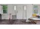 Bright living room with natural light, showcasing hardwood floors and a blank canvas for personalization at 1551 S University Blvd, Denver, CO 80210