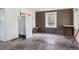 The living room offers natural light, ready for renovation at 1551 S University Blvd, Denver, CO 80210